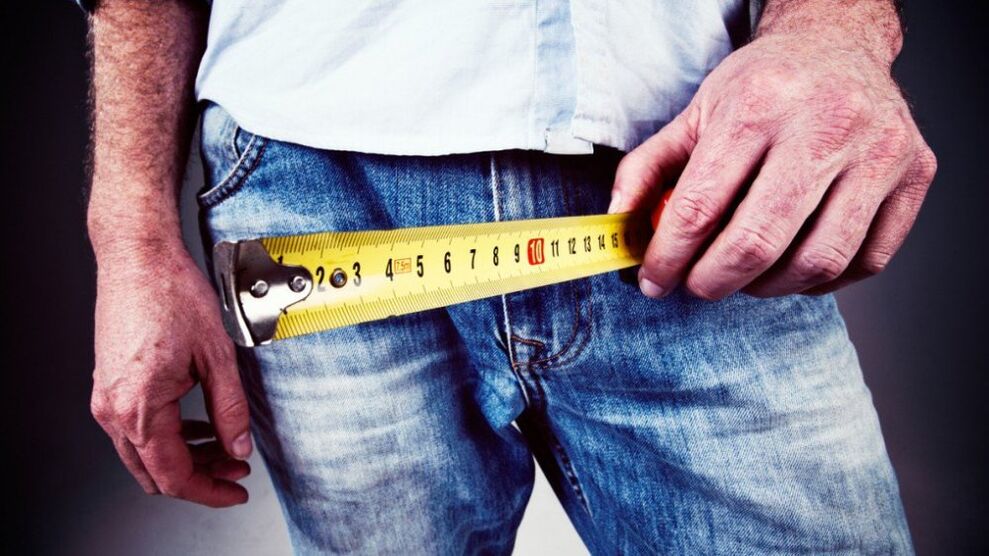 man measuring penis after enlargement with gel